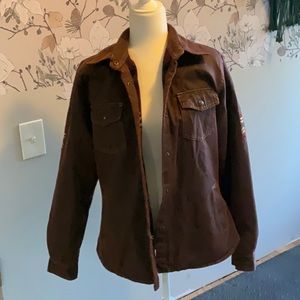 thick brown coat with detailed back and sleves